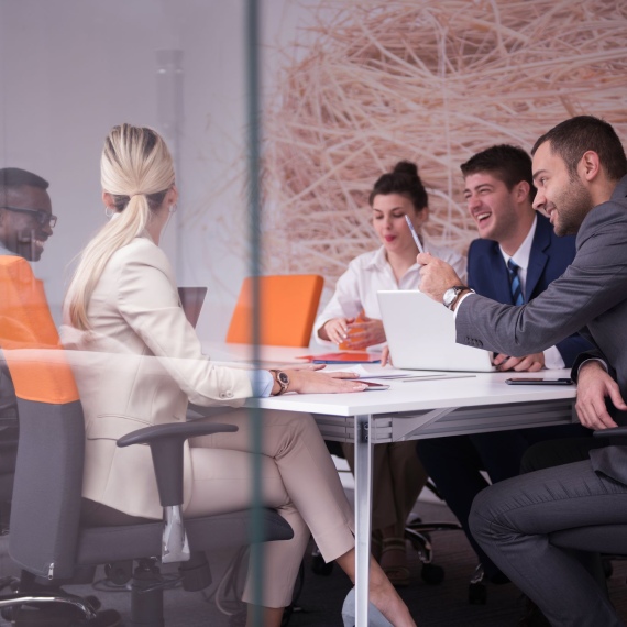 A team discussing local business ideas around a table